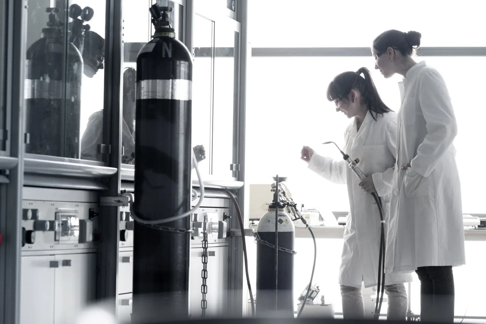 Two young female chemistry students in lab utc